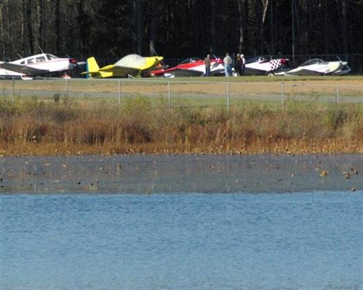 airplanesatairportacrosslakebaileyfromcampgroundpetitjeanstateparkarkansas.jpg