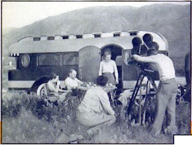 This roomy vehicle carries motion-picture personnel and equipment for making short colored features